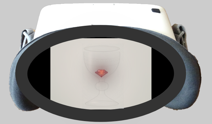 The ganzflicker headset seen from the eyepiece side. Its window is filled with a pale luminous cream haze, and a faint translucent outline of an ornate glass chalice stands at the centre, barely distinguishable from the glow. A small ruby rests in the bowl, radiating a soft red light.